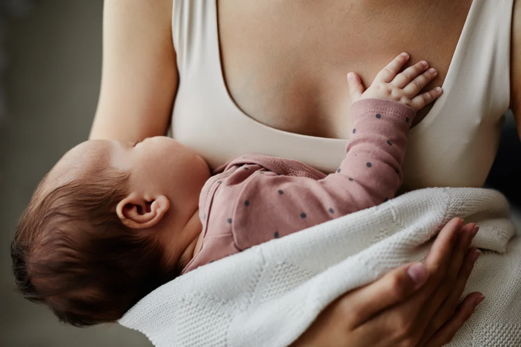 woman holding newborn baby in gentle embrace